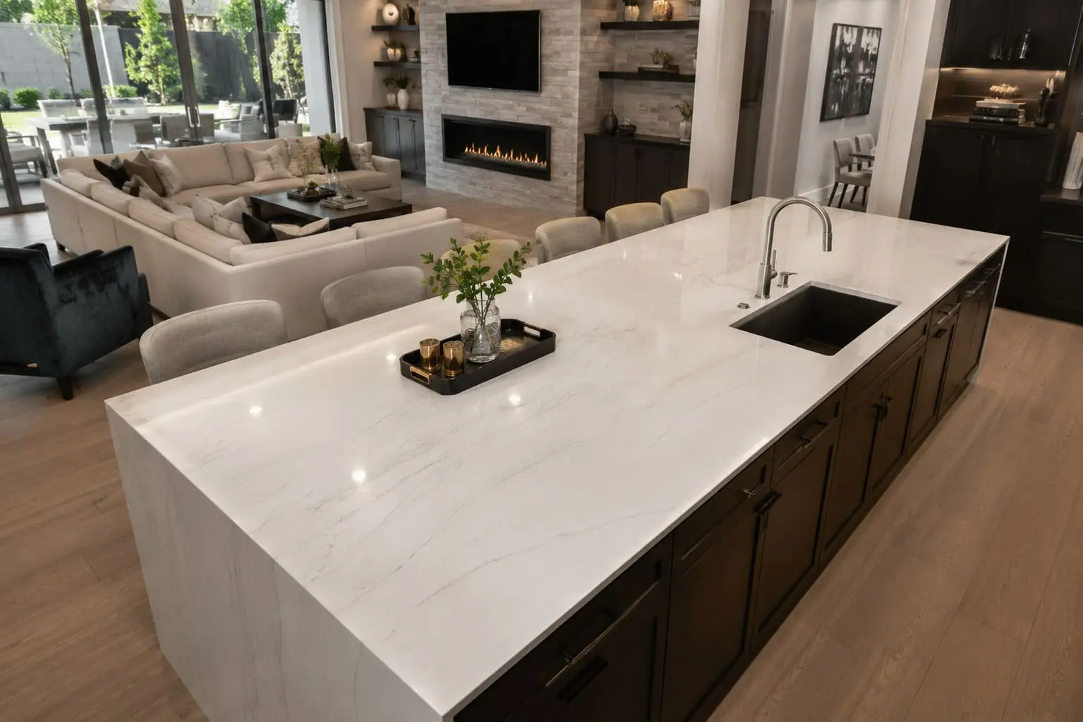 Conceptual rendering of a polished white and gray waterfall-edge kitchen island countertop