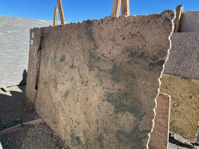 Autumn Dunes granite slab with warm tan and beige tones