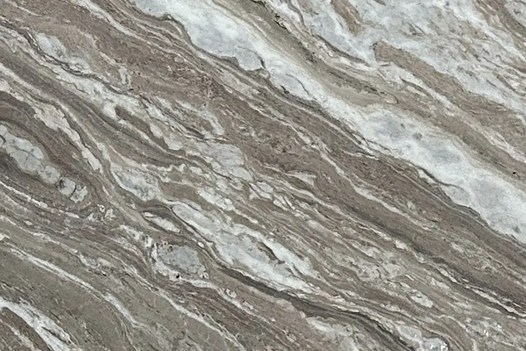 Fantasy Brown dolomite slab with tan and white linear veining at Nova Tile and Stone Minden showroom