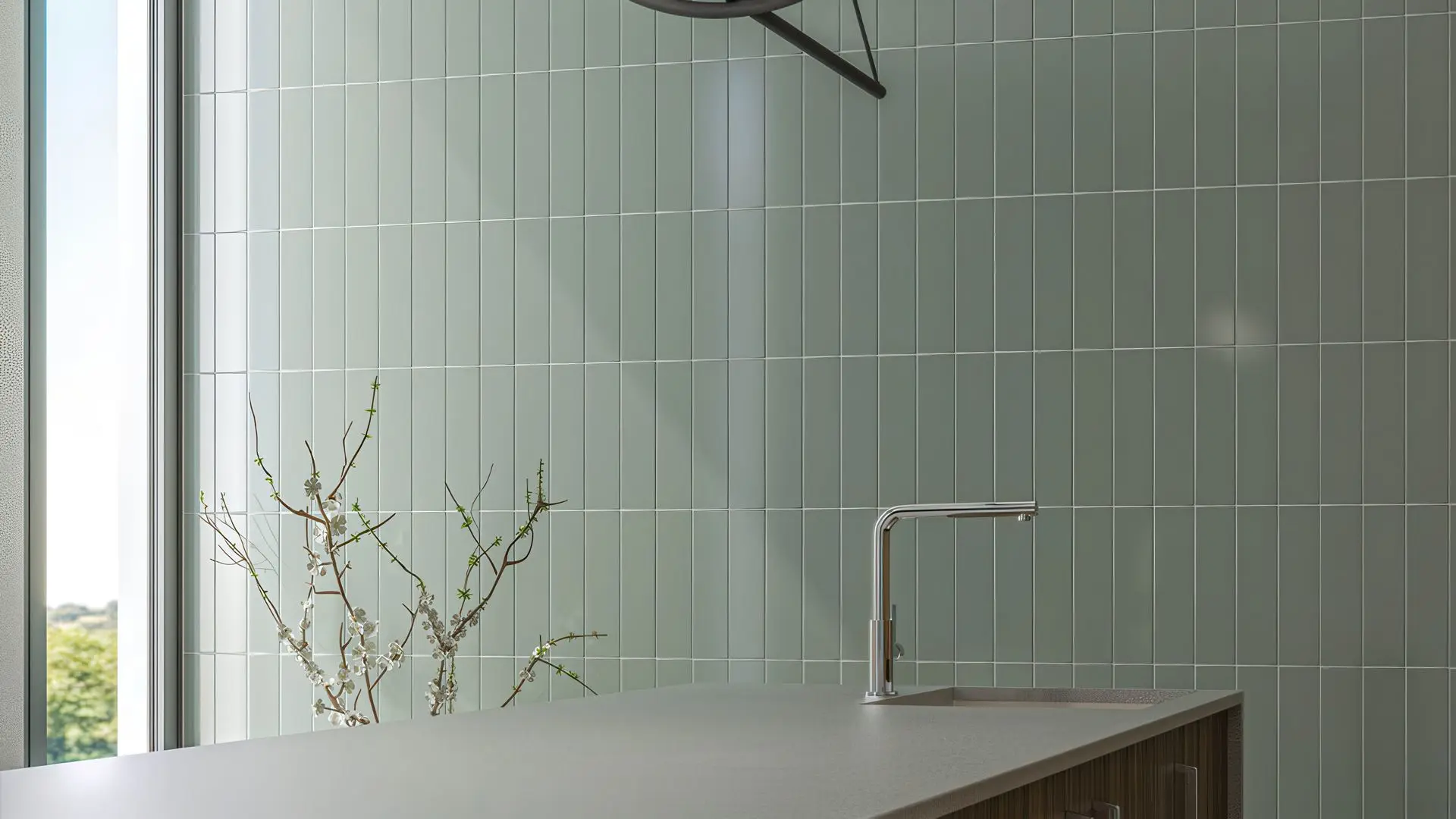Kitchen wall with vertical mint-green large format subway tiles