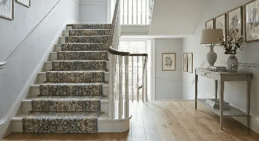 Staircase with patterned carpet runner at Nova Tile and Stone showroom