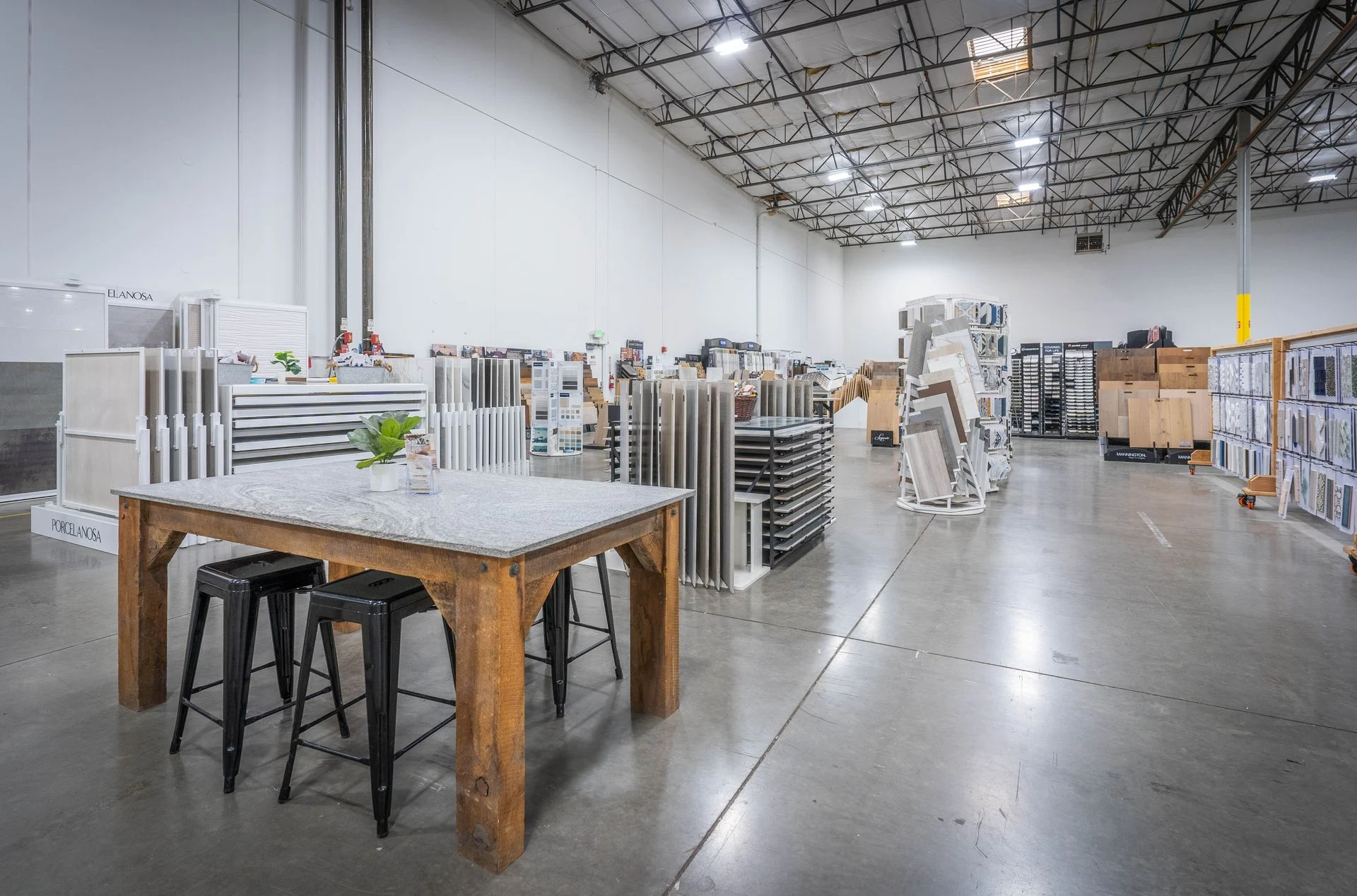 Design consultation area with tile and flooring sample displays at Nova Tile Reno showroom